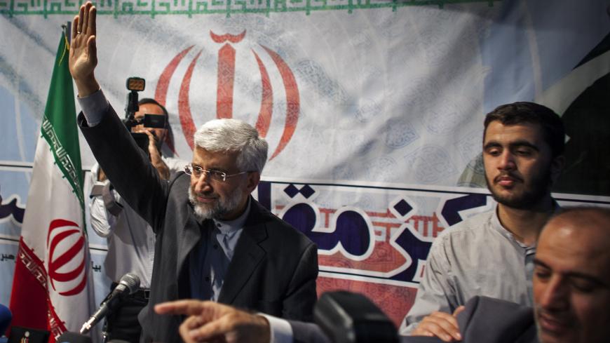 TEHRAN, IRAN - MAY 29: Iran's top nuclear negotiator and presidential candidate for the upcoming elections, Saeed Jalili, waves during a campaign rally, attended by his female supporters on May 29, 2013 in Tehran, Iran. Jalili, who is running in next month's presidential elections says he will promote a policy of resistance against the West if elected. The elections are scheduled for June 14 and Jalili has stated that he wishes to revive policies of the 1979 Islamic revolution that brought clerics to power.