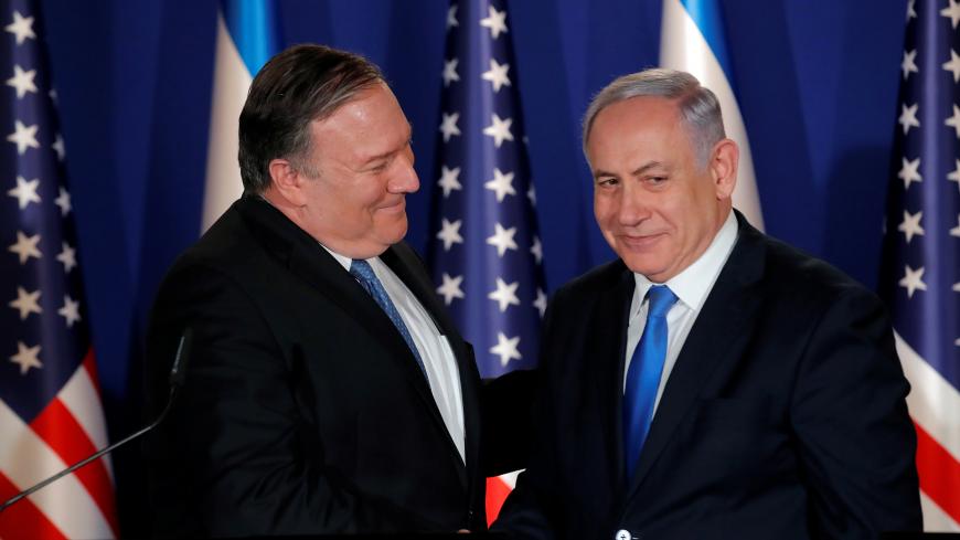 U.S. Secretary of State Mike Pompeo shake hands with Israeli Prime Minister Benjamin Netanyahu, during their visit at Netanyahu's official residence in Jerusalem March 21, 2019. REUTERS/Jim Young/Pool - RC1CDE43DCA0