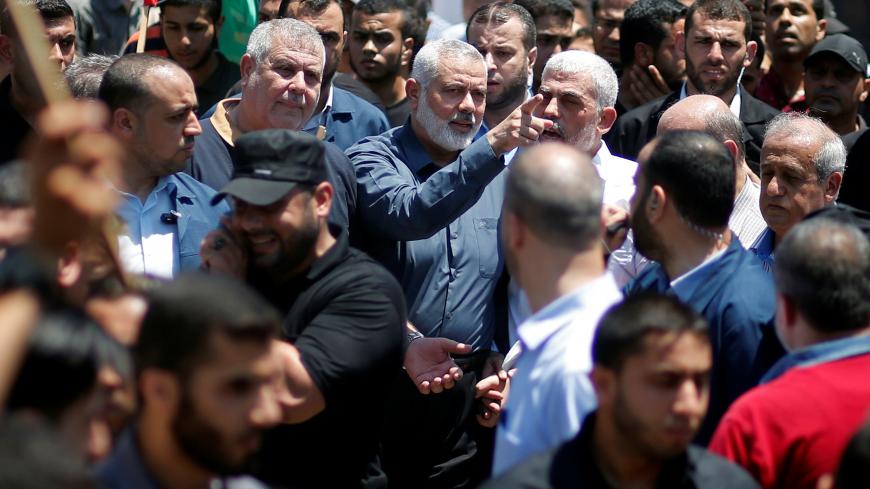 Hamas Chief Ismail Haniyeh, Gaza's Hamas Chief Yehya Al-Sinwar, and other Palestinian factions' leaders take part in a protest against Bahrain's workshop for U.S. Middle East peace plan, in Gaza City, June 26, 2019. REUTERS/Mohammed Salem - RC169399FED0