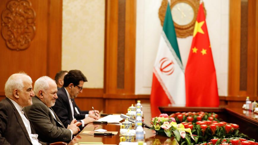 Iranian Foreign Minister Mohammad Javad Zarif (2nd L) speaks with Chinese Foreign Minister Wang Yi (not pictured) at the Diaoyutai State Guesthouse in Beijing, China August 26, 2019.  How Hwee Young/Pool via REUTERS - RC1FEEA021B0