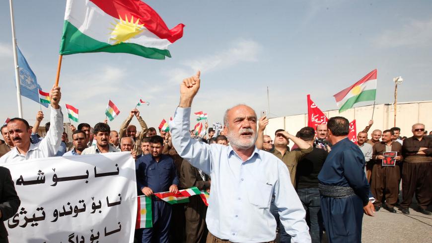 Iraqi Kurds protest against the Turkish offensive against Syria during a demonstration outside the United Nations building in Erbil, Iraq October 12, 2019. Picture taken October 12, 2019. REUTERS/Azad Lashkari - RC1C3DA85ED0