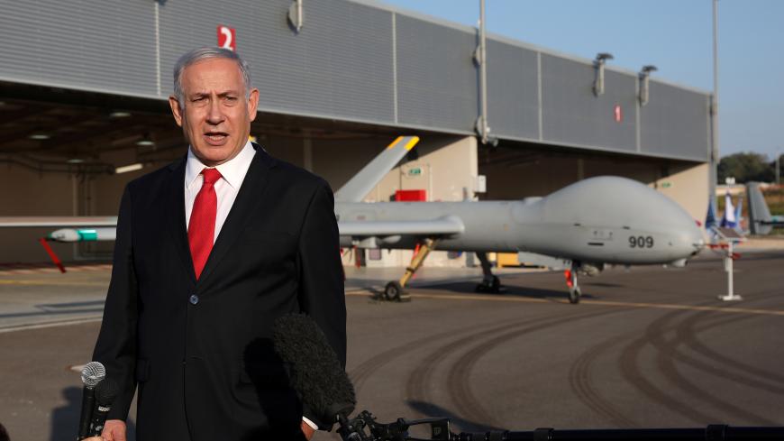 Israeli Prime Minister Benjamin Netanyahu delivers a statement to the media after reviewing an exhibition by the Israeli Air Force at the Palmachim Air Force Base near the city of Rishon LeZion in central Israel October 27, 2019. Abir Sultan/Pool via REUTERS - RC1D3C0793A0