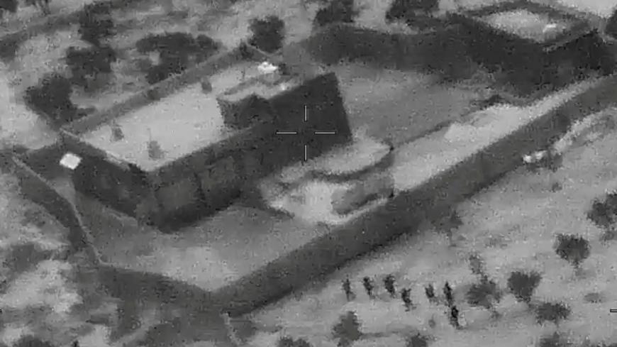 U.S. special forces move towards the compound of Islamic State leader Abu Bakr al-Baghdadi during a raid in the Idlib region of Syria in a still image from video October 26, 2019. Video picture taken October 26, 2019.  U.S. Department of Defense/Handout via REUTERS. THIS IMAGE HAS BEEN SUPPLIED BY A THIRD PARTY.     TPX IMAGES OF THE DAY - RC151E5EB540