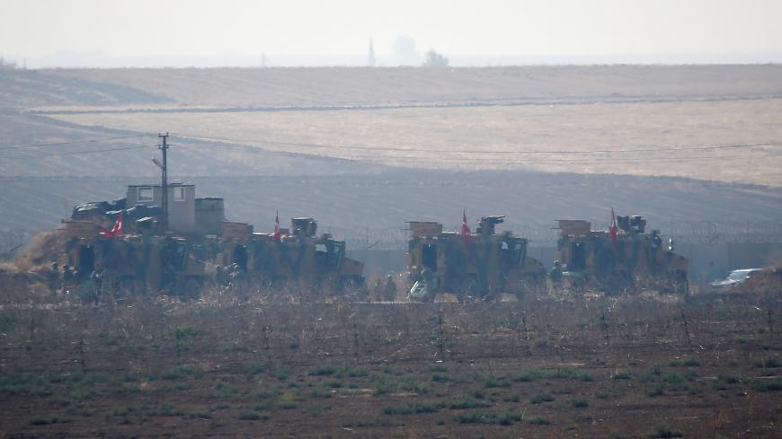 Turkish military vehicles arrive at the Turkish-Syrian border before a joint Turkish-Russian patrol in northeast Syria, near the Turkish border town of Kiziltepe in Mardin province, Turkey, November 1, 2019. REUTERS/Kemal Aslan - RC188E120370