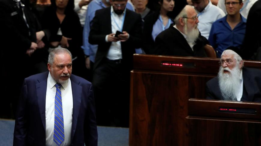 Former Israel's Defence Minister Avigdor Lieberman stands at the plenum at the Knesset, Israel's parliament, in Jerusalem May 30, 2019. REUTERS/Ronen Zvulun - RC1EF1B61B60