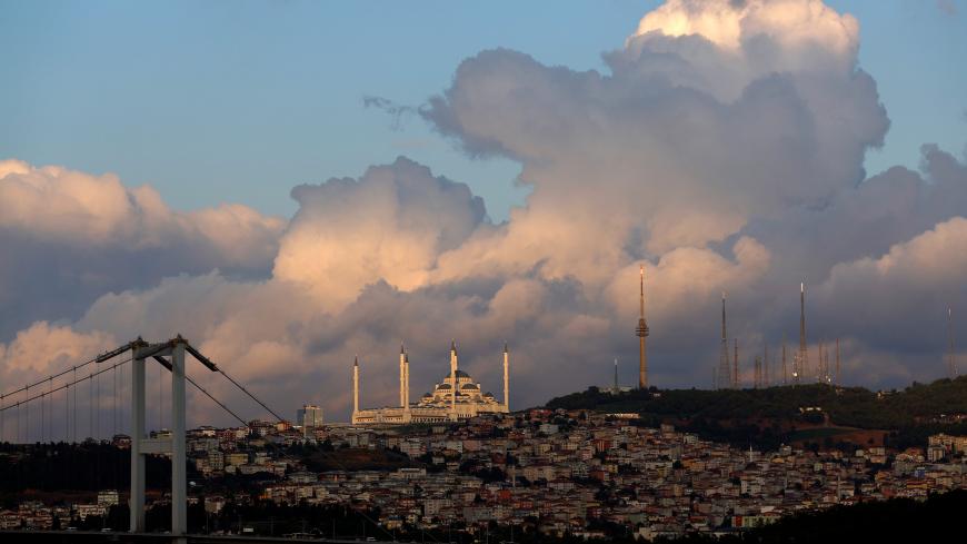 Clouds pass over the Grand Camlica Mosque in Istanbul, Turkey, July 24, 2019. REUTERS/Murad Sezer - RC160610E3C0