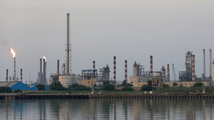 A general view of Abadan oil refinery in southwest Iran, is pictured from Iraqi side of Shatt al-Arab in Al-Faw south of Basra, Iraq September 21, 2019. REUTERS/Essam Al-Sudani - RC171C70A610