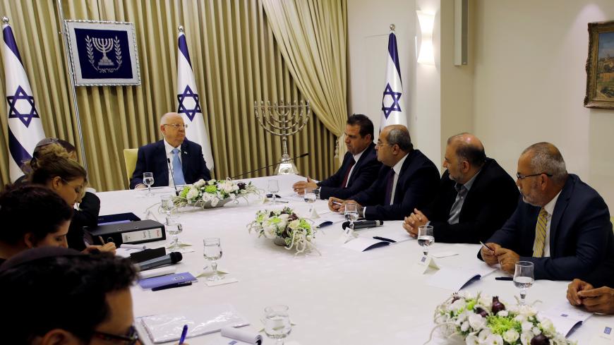 Memebers of the Joint List party, sits next to Israeli President Reuven Rivlin as he began talks with political parties over who should form a new government, at his residence in Jerusalem September 22, 2019. Menachen Kahana/Pool via REUTERS - RC1545ABB3C0