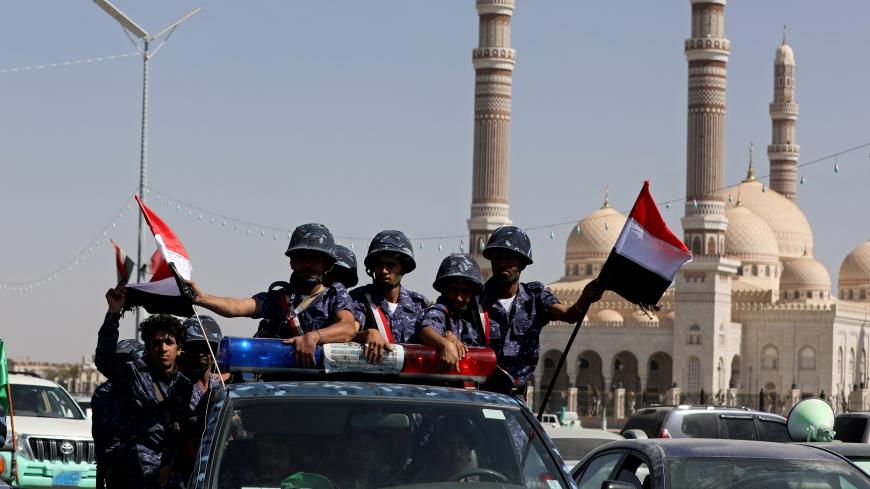 Houthi police troopers ride on the back of a patrol truck in Sanaa, Yemen November 5, 2019. REUTERS/Khaled Abdullah - RC1558A55720