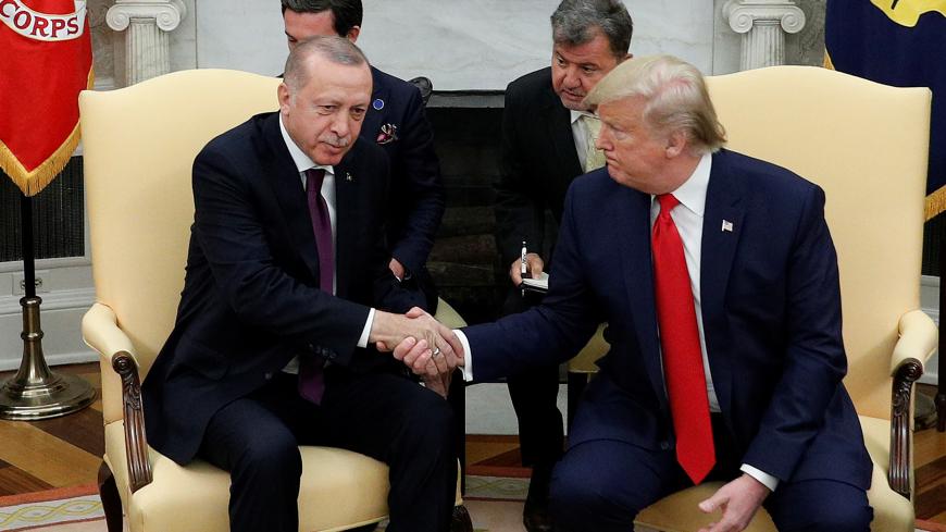 U.S. President Donald Trump meets with Turkey's President Tayyip Erdogan in the Oval Office of the White House in Washington, U.S., November 13, 2019. REUTERS/Tom Brenner? - RC2HAD9VX4UB
