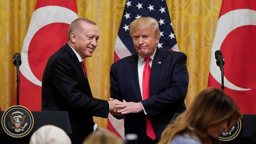 U.S. President Donald Trump and Turkey's President Tayyip Erdogan shake hands at the end of a joint news conference at the White House in Washington, U.S., November 13, 2019. REUTERS/Joshua Roberts - RC2LAD9PASW2