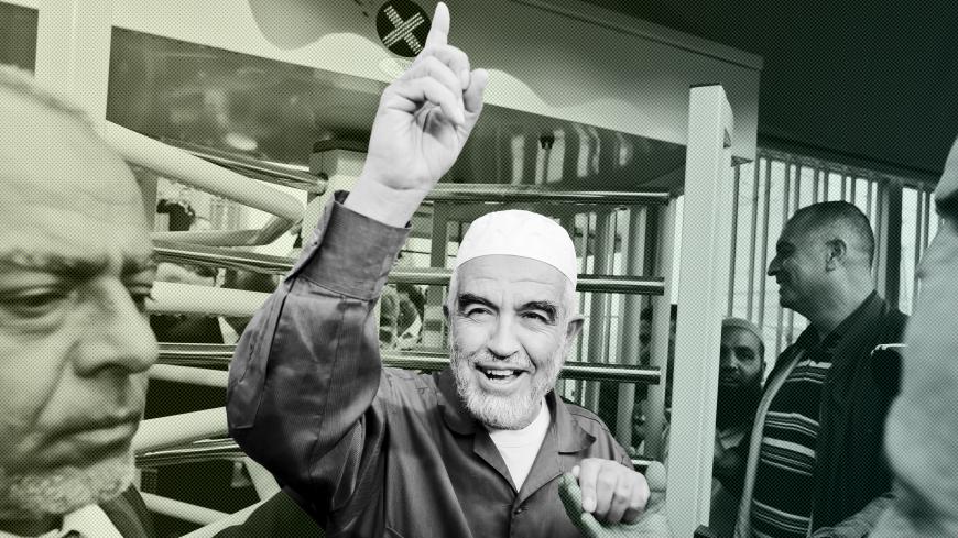 Leader of the northern Islamic Movement Sheikh Raed Salah gestures as he leaves the district court in Jerusalem October 27, 2015. The Arab Israeli Muslim leader, seen by Israel as a powerful voice stoking Palestinian anger over a Jerusalem holy site, was ordered jailed for 11 months on Tuesday for comments he made in 2007. Sheik Raed Salah, leader of the Islamic Movement's northern section was convicted for incitement to violence in 2013, the Justice Ministry said, charges he denied. His attorney said he wo