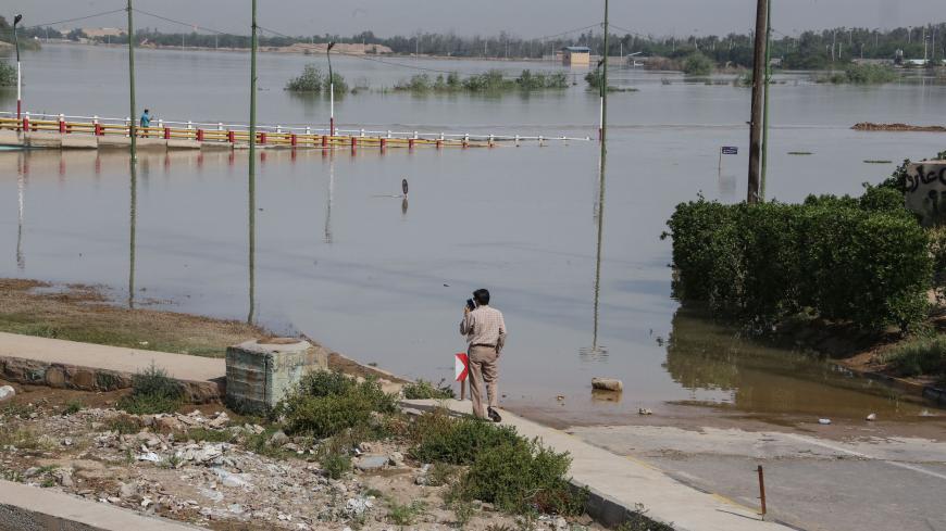 This picture taken on April 11, 2019 shows trees partially submerged by water from floods in Ahvaz, the capital of Iran's southwestern province of Khuzestan - Authorities ordered tens of thousands of residents of the southwestern Iranian city of Ahvaz to evacuate immediately on April 10 as floodwaters entered the capital of oil-rich Khuzestan province, state television reported. (Photo by ATTA KENARE / AFP)        (Photo credit should read ATTA KENARE/AFP via Getty Images)