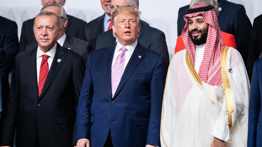 dpatop - 28 June 2019, Japan, Osaka: Recep Tayyip Erdogan (l-r), President of Turkey, Donald Trump, President of the United States of America (USA), Mohammed bin Salman bin Abdelasis al-Saud, Crown Prince of Saudi Arabia, and Shinzo Abe, Prime Minister of Japan, stand side by side in the group picture at the start of the G20 summit. The heads of state and government of the 19 leading industrialised and emerging countries and the European Union will meet at the G20 summit in Osaka (Japan) on 28 and 29 June 2