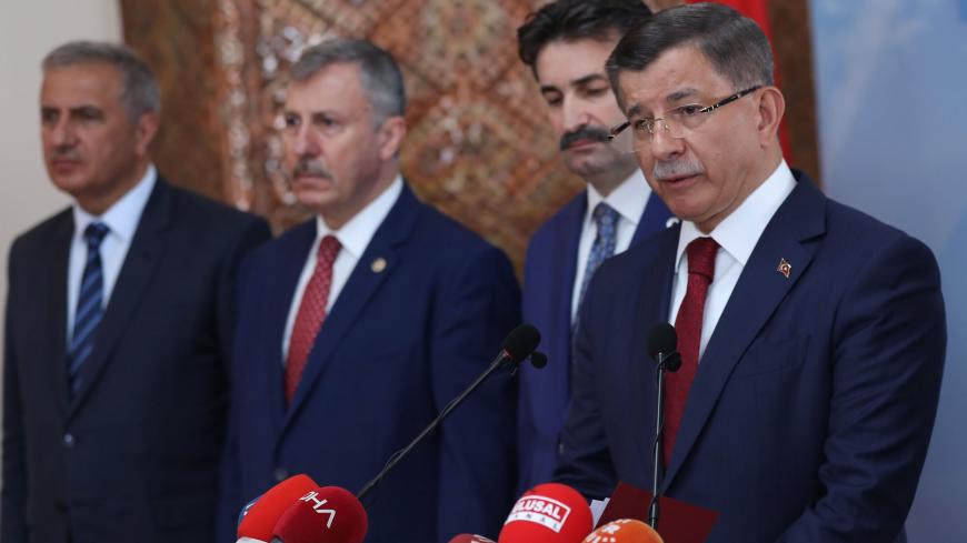 Former Turkish Prime Minister Ahmet Davutoglu (R) holds a press conference at his home in Ankara on September 13, 2019, to announce that he would launch a "new political movement" in the latest challenge to President Recep Tayyip Erdogan from his former allies. (Photo by Adem ALTAN / AFP)        (Photo credit should read ADEM ALTAN/AFP via Getty Images)