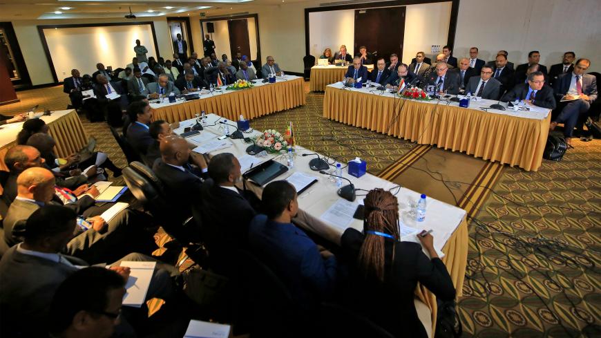 The Irrigation Ministers of Egypt, Ethiopia, and Sudan take part in a meeting to resume negotiations on the Grand Ethiopian Renaissance Dam, in the Sudanese capital Khartoum on December 21, 2019. - Egypt, Ethiopia and Sudan set last month in Washington a January 15 target for resolving the dispute over the construction by Addis Ababa of the Grand Ethiopian Renaissance Dam on the Nile. The Nile is a lifeline supplying both water and electricity to the 10 countries it traverses. Analysts fear the three Nile b