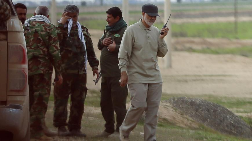 Iranian Revolutionary Guard Commander Qassem Soleimani uses a walkie-talkie at the frontline during offensive operations against Islamic State militants in the town of Tal Ksaiba in Salahuddin province March 8, 2015. Picture taken March 8, 2015.   REUTERS/Stringer (IRAQ - Tags: CIVIL UNREST CONFLICT POLITICS) - GM1EB3I1GO301