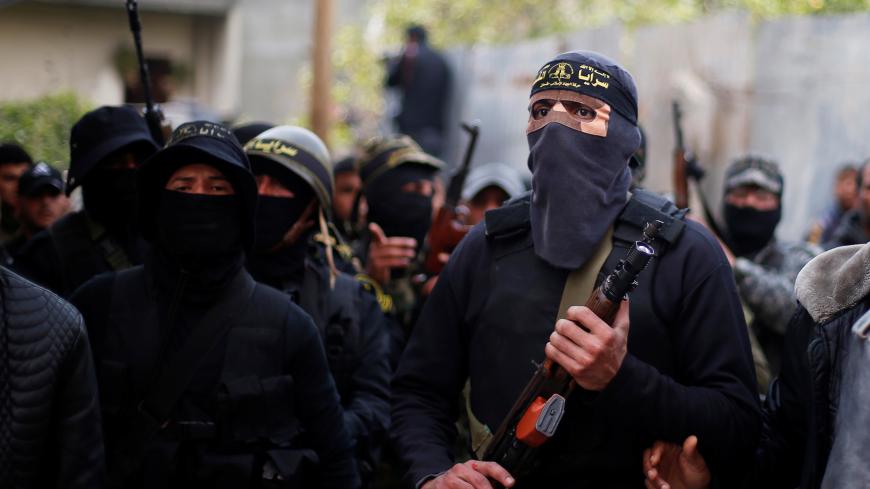 Islamic Jihad militants attend the funeral of Palestinian Jehad Hararah who was killed at the Israeli-Gaza border fence, in Gaza City March 23, 2019. REUTERS/Mohammed Salem - RC1B410D6340