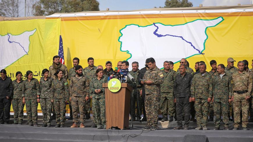 Mazloum Kobani, Syrian Democratic Forces' (SDF) commander in chief, talks as he announces the destruction of Islamic State's control of land in eastern Syria, at al-Omar oil field in Deir Al Zor, Syria March 23, 2019. - RC1F71152EF0