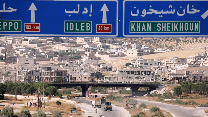 Road direction signs are pictured at the entrance enroute to Khan Sheikhoun, Idlib, Syria August 24, 2019. REUTERS/Omar Sanadiki - RC18F81DAAE0