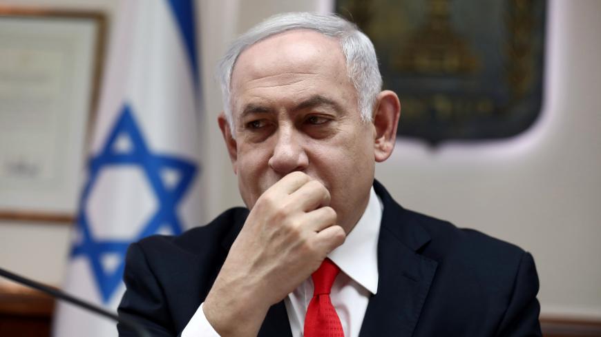 Israeli Prime Minister Benjamin Netanyahu looks on as he chairs the weekly cabinet meeting at his Jerusalem office December 15, 2019. Gali Tibbon/Pool via REUTERS - RC2MVD9F1YP9