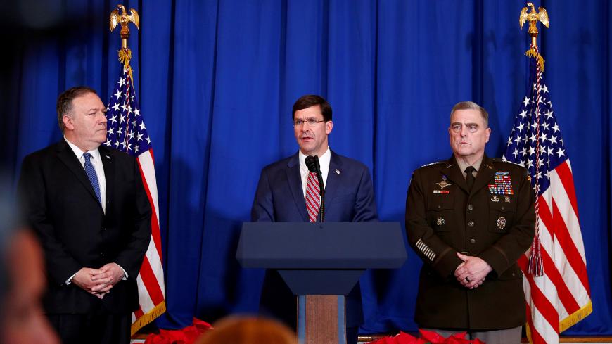 U.S. Defense Secretary Mark Esper speaks about airstrikes by the U.S. military in Iraq and Syria, at the Mar-a-Lago resort in Palm Beach, Florida, U.S., December 29, 2019. With him are U.S. Army General Mark Milley and U.S. Secretary of State Mike Pompeo. REUTERS/Tom Brenner - RC2C5E9P88JE