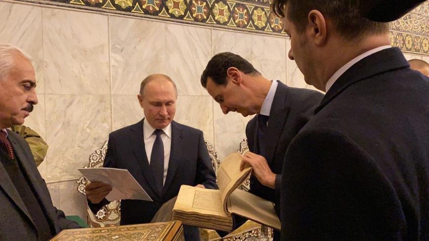 Russian President Vladimir Putin is seen with Syria's President Bashar al-Assad at Umayyad Mosque, in Damascus, Syria in this handout released by SANA on January 7, 2020. SANA/Handout via REUTERS ATTENTION EDITORS - THIS IMAGE WAS PROVIDED BY A THIRD PARTY. REUTERS IS UNABLE TO INDEPENDENTLY VERIFY THIS IMAGE - RC23BE9NJLQX