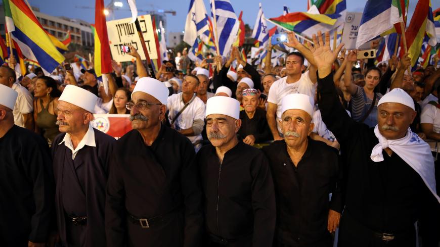 Leaders from the Druze minority together with others take part in a rally to protest against Jewish nation-state law in Rabin square in Tel Aviv, Israel, August 4, 2018. REUTERS/Corinna Kern - RC1149638BE0