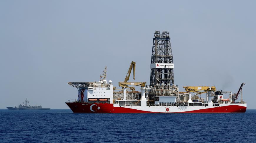 Turkish drilling vessel Yavuz is escorted by Turkish Navy frigate TCG Gemlik (F-492) in the eastern Mediterranean Sea off Cyprus, August 6, 2019. Picture taken August 6, 2019. REUTERS/Murad Sezer - RC1256FE7C90