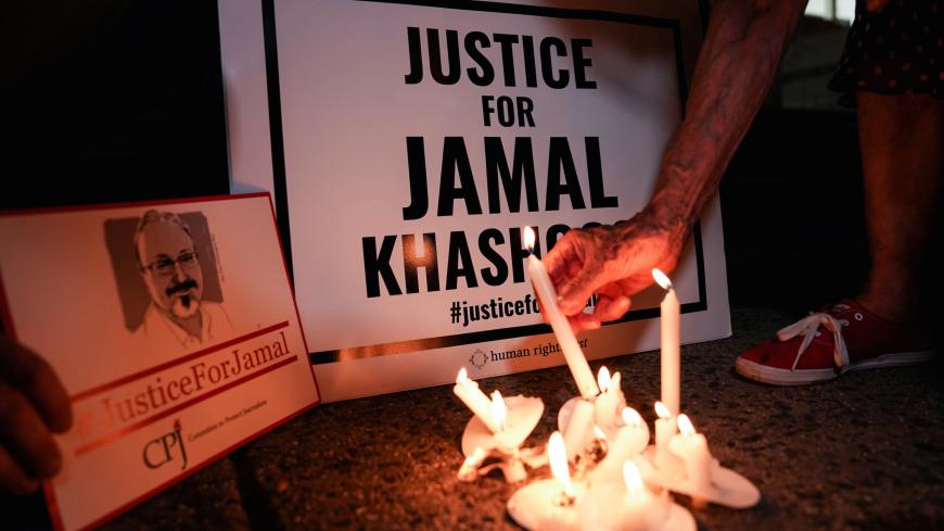 The Committee to Protect Journalists and other press freedom activists hold a candlelight vigil in front of the Saudi Embassy to mark the anniversary of the killing of journalist Jamal Khashoggi at the kingdom's consulate in Istanbul, Wednesday evening in Washington, U.S., October 2, 2019. REUTERS/Sarah Silbiger. - RC16BA3B3F60