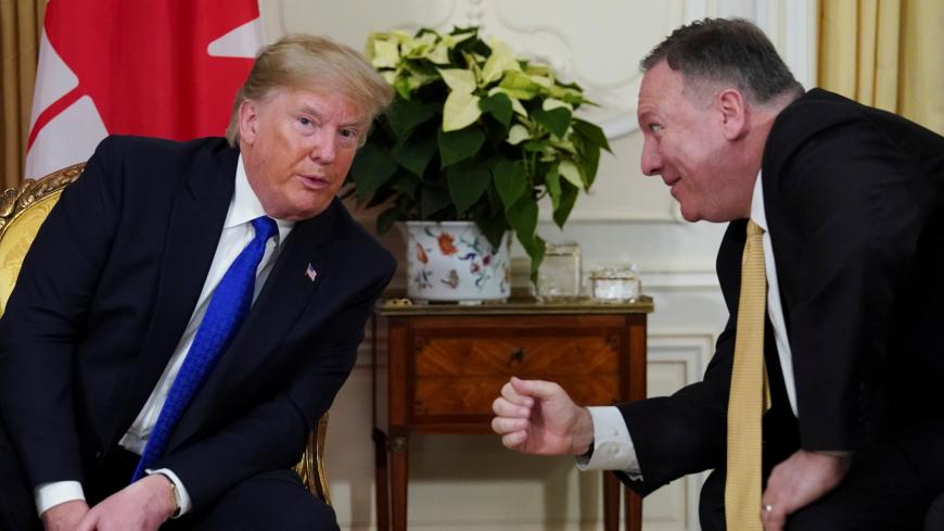 U.S. President Donald Trump and U.S. Secretary of State Mike Pompeo talk during a meeting with Canada's Prime Minister Justin Trudeau (not pictured), ahead of the NATO summit in Watford, in London, Britain, December 3, 2019. REUTERS/Kevin Lamarque - RC2SND9G88LE