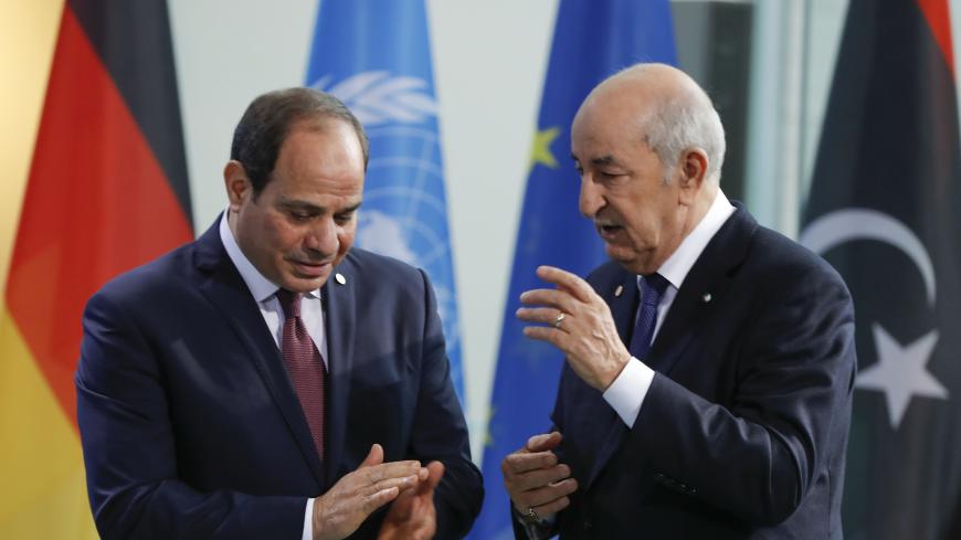 Egyptian President Abdul Fattah al-Sisi (L) and Algerian president Abdelmadjid Tebboune talk before posing for a family picture during a Peace summit on Libya at the Chancellery in Berlin, on January 19, 2020. - World leaders gather in Berlin on January 19, 2020 to make a fresh push for peace in Libya, in a desperate bid to stop the conflict-wracked nation from turning into a "second Syria". Chancellor Angela Merkel will be joined by the presidents of Russia, Turkey and France and other world leaders for ta