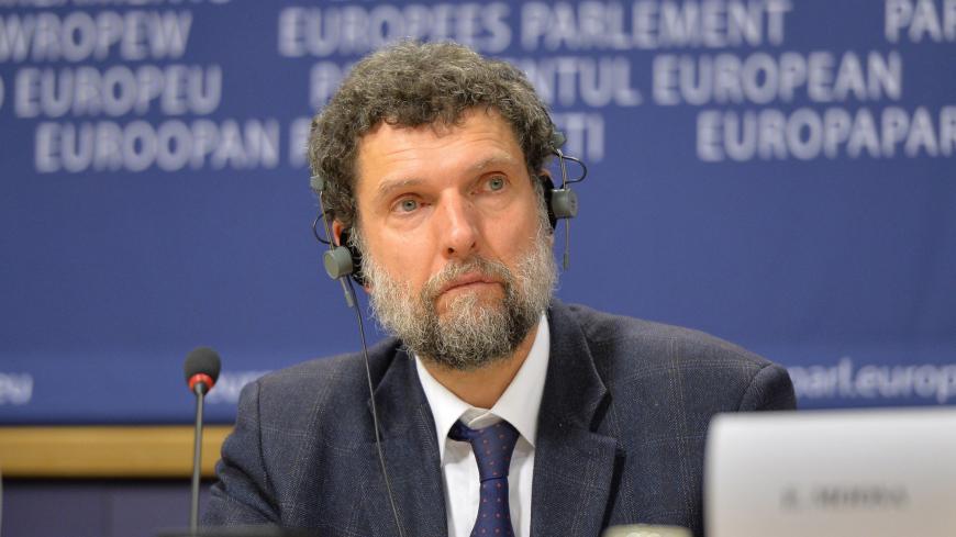BRUSSELS, BELGIUM - DECEMBER 11:  Member of the International Peace and Reconciliation Initiative (IPRI) delegation to Turkey Osman Kavala is seen during a joint press conference with Chair of the Confederal Group of the European United Left - Nordic Green Left at the European Parliament Gabriele Zimmer, Chair of IPRI Judge Essa Moosa, French politician Francis Wurtz and Chair of the EU Turkey Civic Commission (EUTCC) Kariane Westrheim after 11th International Conference on the European Union, Turkey, the M