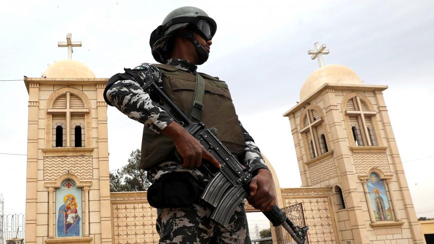 A member of Egypt special police forces guards the Coptic Orthodox White Monastery site in Sohag, Egypt April 6, 2019. REUTERS/Mohamed Abd El Ghany - RC120782D770