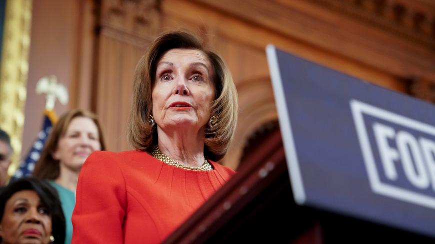 Speaker of the House Nancy Pelosi, joined by fellow Democrats, speaks during a news conference about legislation the House has passed at the Capitol in Washington, U.S., December 19, 2019. REUTERS/Erin Scott - RC2JYD99KMA3