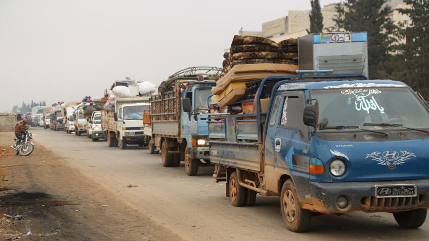Trucks carry belongings of people fleeing from Maarat al-Numan, in northern Idlib, Syria December 24, 2019. REUTERS/Mahmoud Hassano - RC2U1E9W99L0