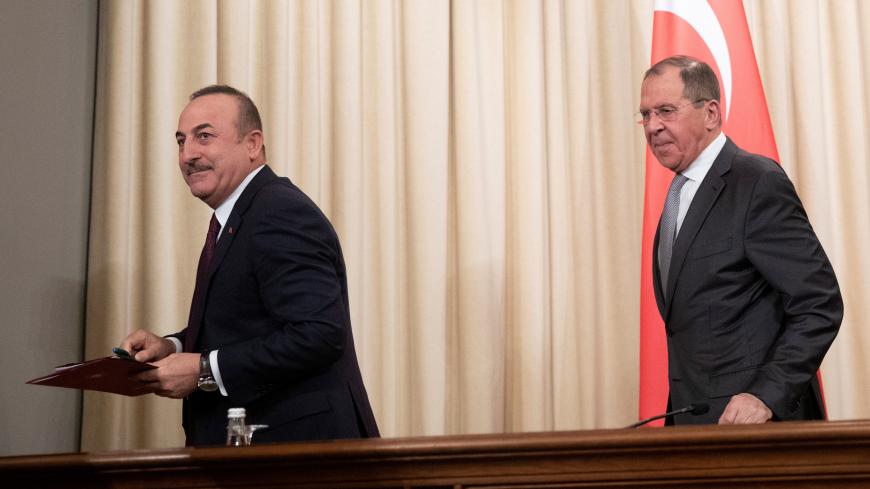 Turkish Foreign Minister Mevlut Cavusoglu and Russian Foreign Minister Sergei Lavrov leave a joint news conference following their talks in Moscow, Russia January 13, 2020. Pavel Golovkin/Pool via REUTERS - RC24FE9RU9P6