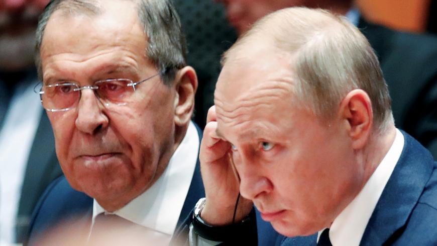 Russian President Vladimir†Putin†and Russia's acting Foreign Minister Sergei Lavrov attend the Libya summit in Berlin, Germany, January 19, 2020.  REUTERS/Hannibal Hanschke/Pool - RC27JE9VYMOG