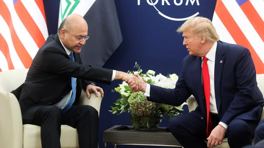 U.S. President Donald Trump shakes hands with Iraqi President Barham Salih as they hold bilateral talks during the 50th World Economic Forum (WEF) annual meeting in Davos, Switzerland, January 22, 2020. REUTERS/Jonathan Ernst - RC2YKE9TXDML