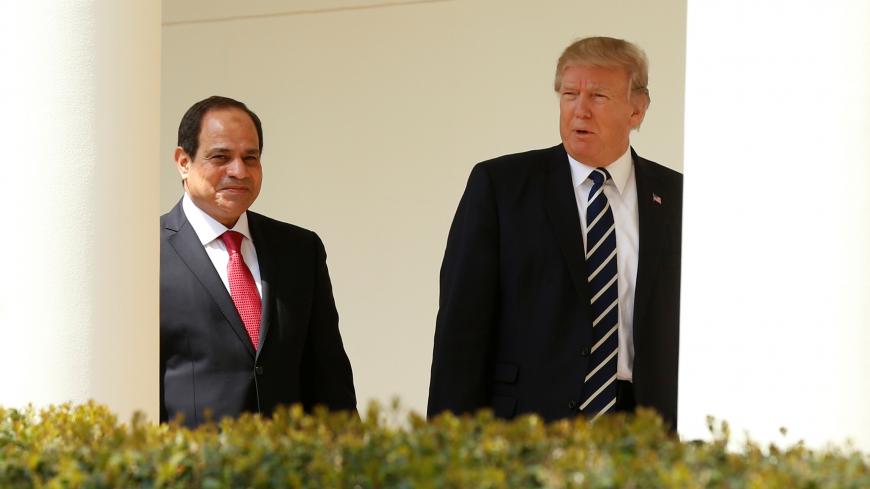 U.S. President Donald Trump and Egyptian President Abdel Fattah al-Sisi walk the colonnade at the White House in Washington, U.S., April 3, 2017. REUTERS/Kevin Lamarque - RC129953EE00
