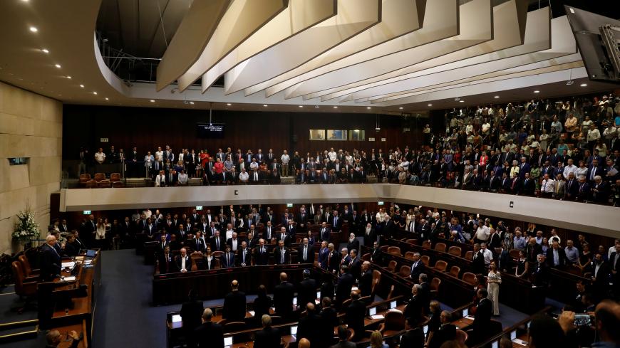 Members of the 22nd Knesset, the Israeli parliament, stand during their swearing-in ceremony, in Jerusalem October 3, 2019. REUTERS/Ronen Zvulun - RC1172B0B270