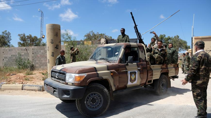 Libyan National Army (LNA) members, commanded by Khalifa Haftar, head out of Benghazi to reinforce the troops advancing to Tripoli, in Benghazi, Libya April 7, 2019. REUTERS/Esam Omran Al-Fetori - RC1A261C5320