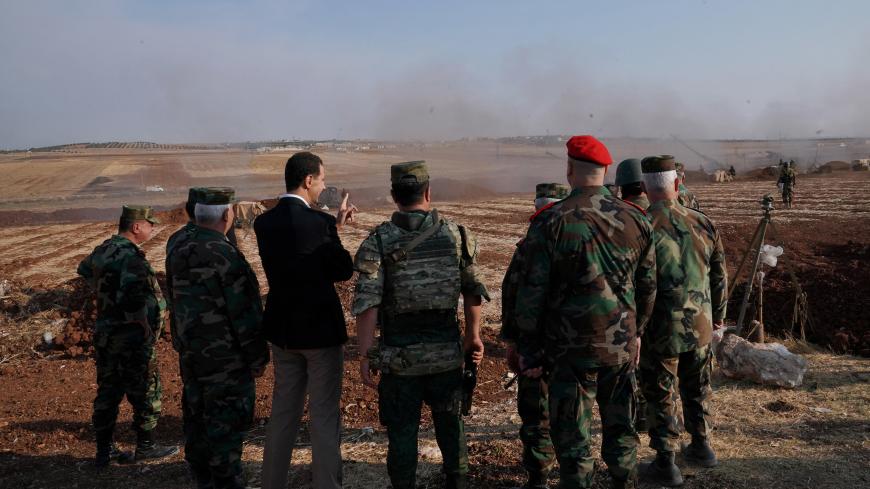 Syrian President Bashar al Assad visits Syrian army troops in war-torn northwestern Idlib province, Syria, in this handout released by SANA on October 22, 2019. SANA/Handout via REUTERS ATTENTION EDITORS - THIS IMAGE WAS PROVIDED BY A THIRD PARTY. REUTERS IS UNABLE TO INDEPENDENTLY VERIFY THIS IMAGE. - RC15BEED62C0