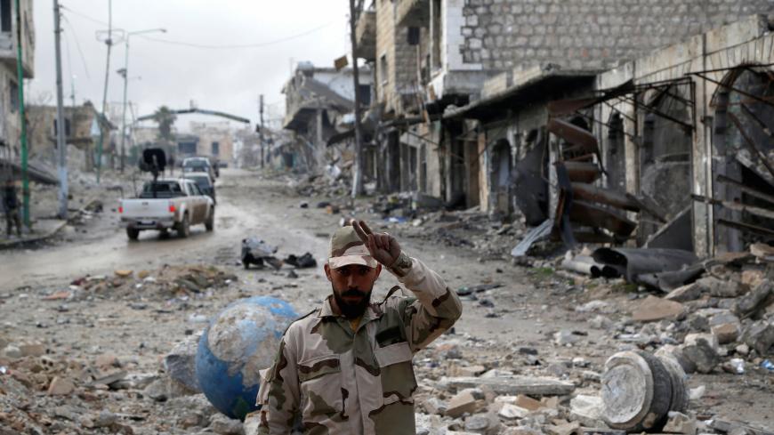 A Syrian army soldier gestures in Maarat al-Numan, Syria, January 30, 2020. REUTERS/Yamam Al Shaar - RC2GQE9GEP2D