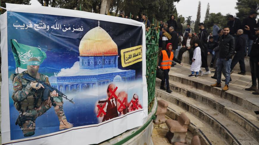 A banner placed by Hamas with a slogan reading in Arabic: " no to the deal of the century" (US-prosed peace plan) is pictured as Palestinian Muslim worshippers gather at the Al-Aqsa mosque compound in the Old City of Jerusalem, on February 14, 2020. (Photo by Ahmad GHARABLI / AFP) (Photo by AHMAD GHARABLI/AFP via Getty Images)