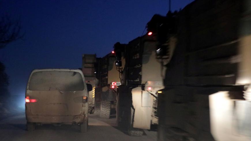 Turkish military vehicles enter the Bab al-Hawa crossing at the Syrian-Turkish border, in Idlib governorate, Syria, February 9, 2020. REUTERS/Khalil Ashawi - RC2AXE9JMDZ8