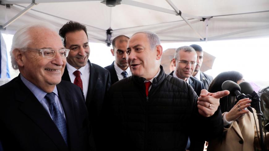 Israeli Prime Minister Benjamin Netanyahu talks to the U.S. Ambassador David Friedman during his visit to Ariel settlement in the West Bank, February 24, 2020. Sebastian Scheiner/Pool via REUTERS - RC287F98LHX4