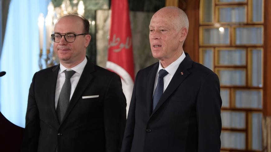 Tunisia's President Kais Saied and Prime Minister Elyes Fakhfakh attend the country's new government swearing-in ceremony at the Carthage Palace outside the capital Tunis, Tunisia February 27, 2020. Fethi Belaid/Pool via REUTERS - RC229F9SJGAR