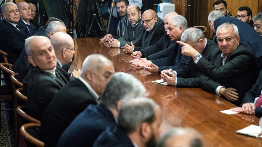 Fatah and Hamas officials wait for a meeting with Russian Foreign Minister Sergei Lavrov and representatives of Palestinian groups and movements as a part of an intra-Palestinian talks in Moscow, Russia February 12, 2019. Pavel Golovkin/Pool via REUTERS - RC173B11DD10
