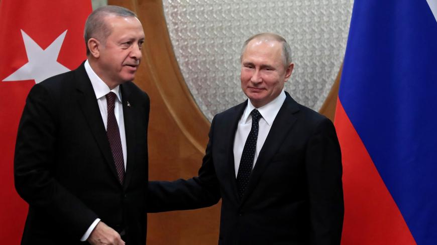 Turkish President Recep Tayyip Erdogan and Russian President Vladimir Putin meet in the Black sea resort of Sochi, Russia February 14, 2019. Sergei Chirikov/Pool via REUTERS - RC1F02430140